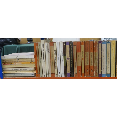 326 - Four shelves of assorted books, to include academic and theological titles, alongside paperback Peng... 