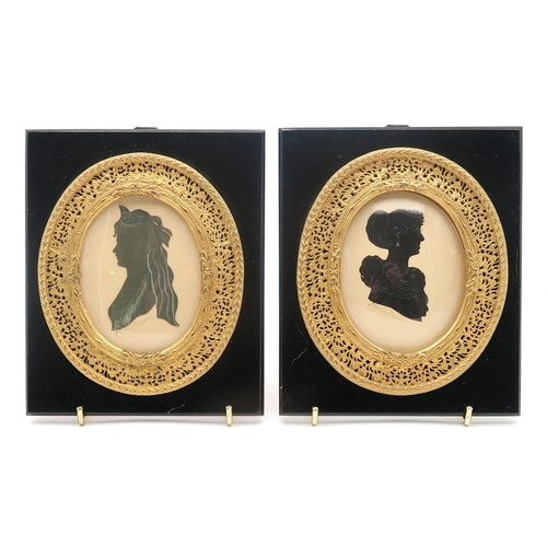 330 - A 19th century silhouette portrait miniature of a lady in profile, housed in a rosewood frame, toget... 