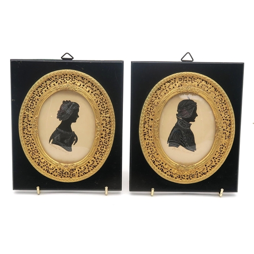 330 - A 19th century silhouette portrait miniature of a lady in profile, housed in a rosewood frame, toget... 