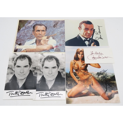 337 - AUTOGRAPHSA small collection of James Bond signed photographs, comprising Sean Connery, Timothy Dalt... 