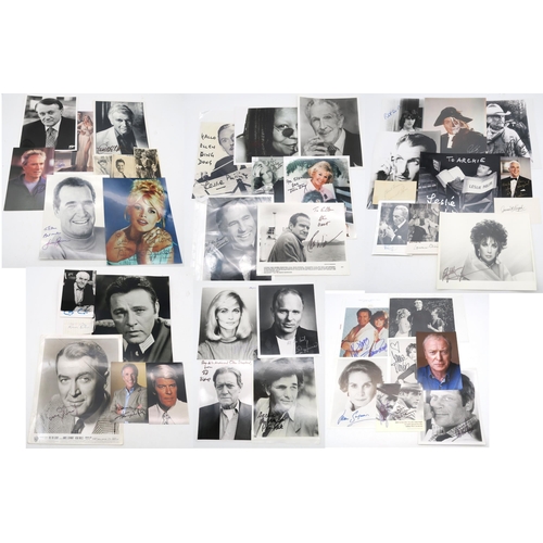 338 - AUTOGRAPHSA large collection of signed photographs of Hollywood stars, to include Veronica Carlson a... 