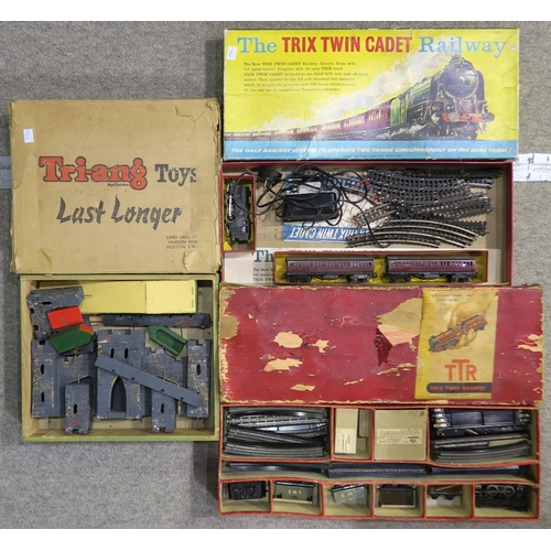 384 - A boxed Trix Twin Cadet Railway set, a further Trix Twin Railway set and a boxed Tri-ang Fort (3)