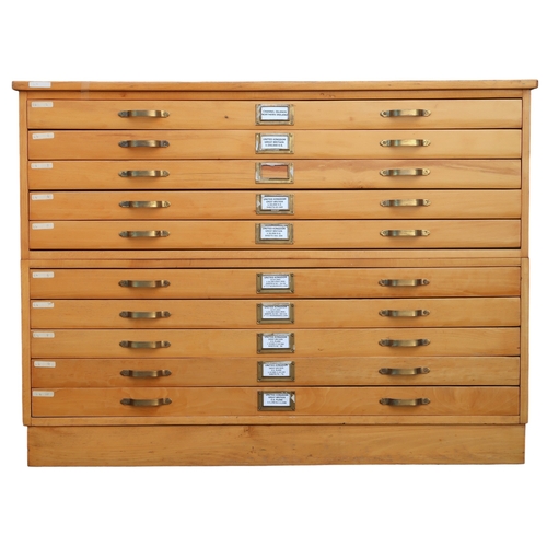 2112 - A 20TH CENTURY PITCH PINE PLAN CHEST with laminate top over ten narrow folio drawers on plinth base,... 