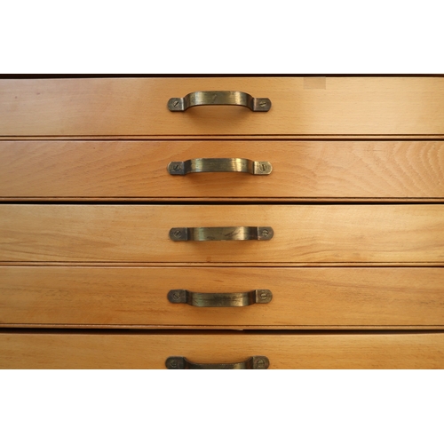 2113 - A 20TH CENTURY PITCH PINE PLAN CHEST with laminate top over ten narrow folio drawers on plinth base,... 