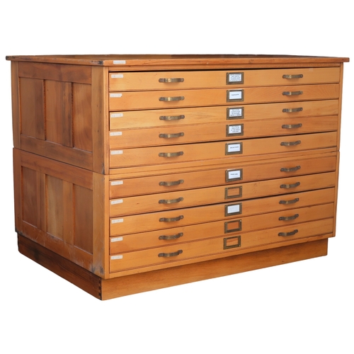 2113 - A 20TH CENTURY PITCH PINE PLAN CHEST with laminate top over ten narrow folio drawers on plinth base,... 