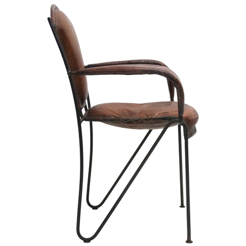 2115 - A MID 20TH CENTURY LEATHER & IRON ARMCHAIR AFTER JACQUES ADNET with open armrests made with stit... 