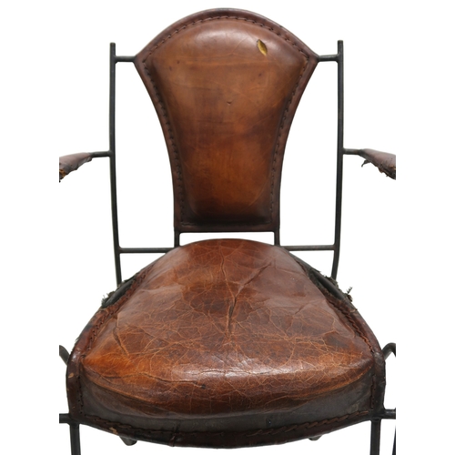 2115 - A MID 20TH CENTURY LEATHER & IRON ARMCHAIR AFTER JACQUES ADNET with open armrests made with stit... 