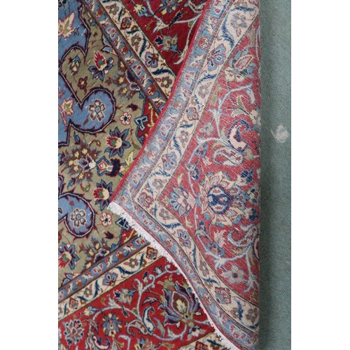 2137 - A LIGHT BLUE GROUND TABRIZ RUG with multicoloured sunburst central medallion on floral patterne... 