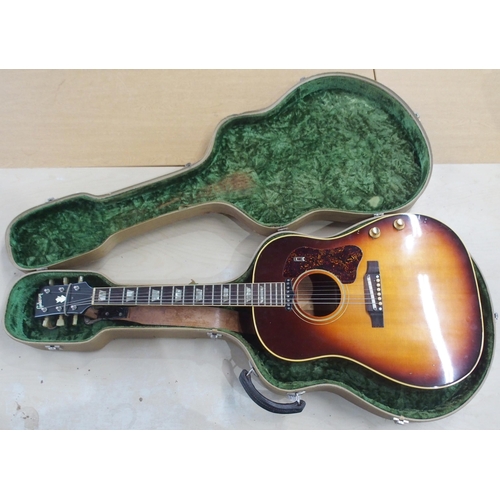 278 - GIBSON a Gibson J160E electro acoustic guitar in dark sunburst serial number 890922 circa 1969 with ... 