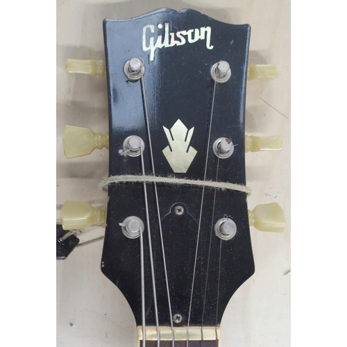 278 - GIBSON a Gibson J160E electro acoustic guitar in dark sunburst serial number 890922 circa 1969 with ... 