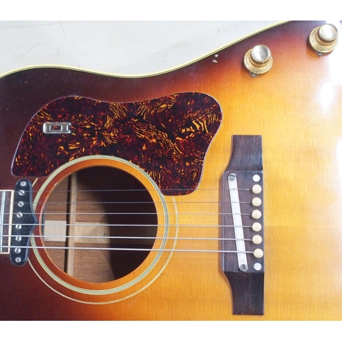 278 - GIBSON a Gibson J160E electro acoustic guitar in dark sunburst serial number 890922 circa 1969 with ... 