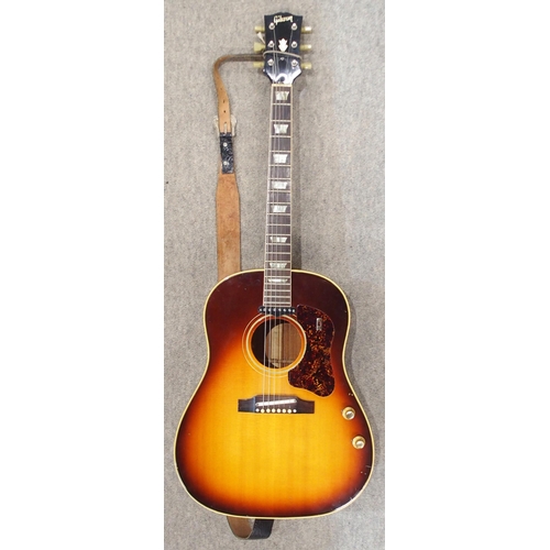 278 - GIBSON a Gibson J160E electro acoustic guitar in dark sunburst serial number 890922 circa 1969 with ... 