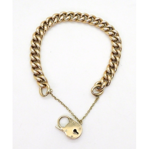 701 - A 9ct gold curb link bracelet, with a padlock clasp, length 19.5cm, weight 19.6gms