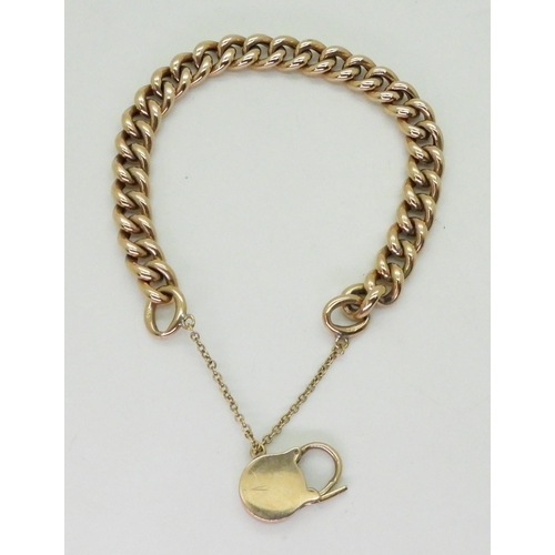 701 - A 9ct gold curb link bracelet, with a padlock clasp, length 19.5cm, weight 19.6gms