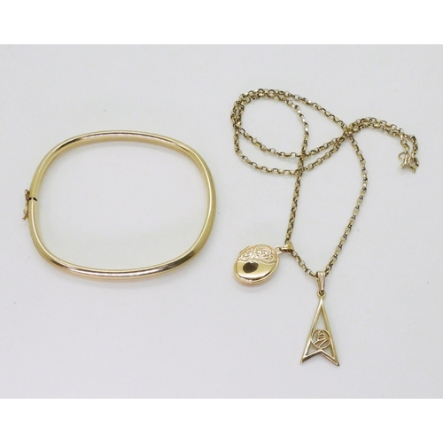 713 - A 9ct gold bangle, chain and two pendants, weight together 13.9gms