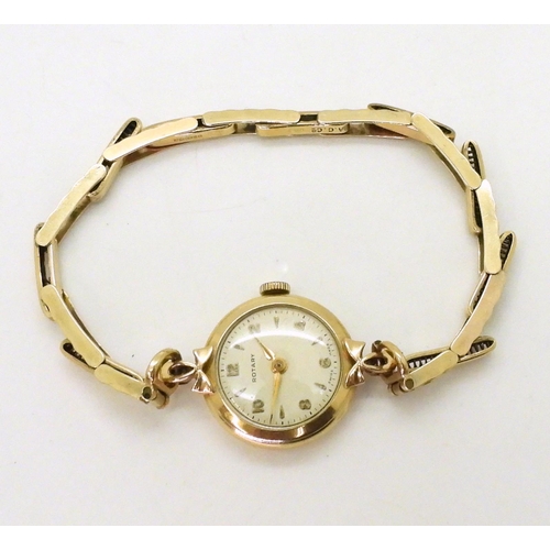 714 - A 9ct gold ladies Rotary watch and strap hallmarked London 1960, weight without mechanism 9gms