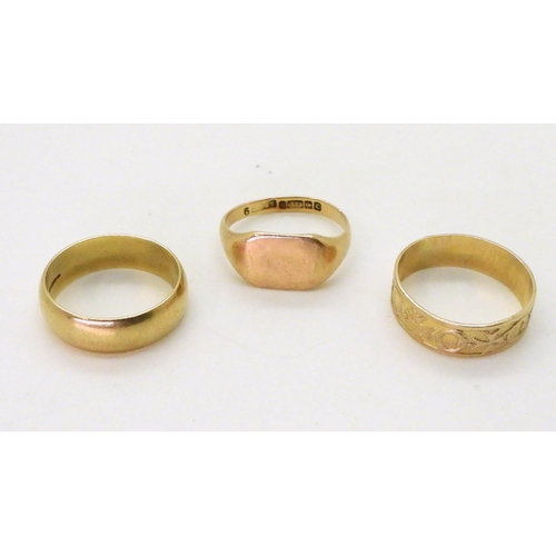 717 - Two 9ct gold wedding rings, sizes Q1/2 and N and a signet ring, size O1/2, weight together 9.2gms