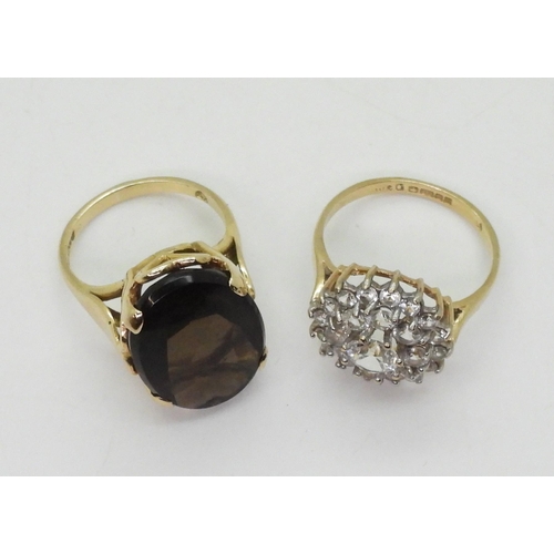 721 - A 9ct gold smoky quartz ring, hallmarked London 1963, size K, and a clear gem set cluster, size O, w... 