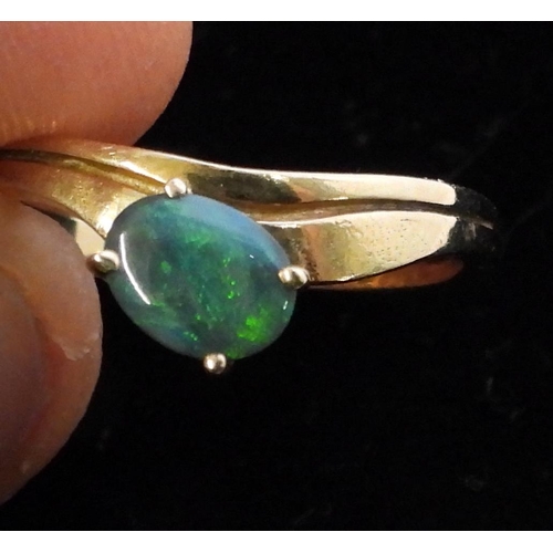 722 - A 14k gold opal set ring, size P1/2, weight 2.6gms, together with a bright yellow metal ring, size L... 