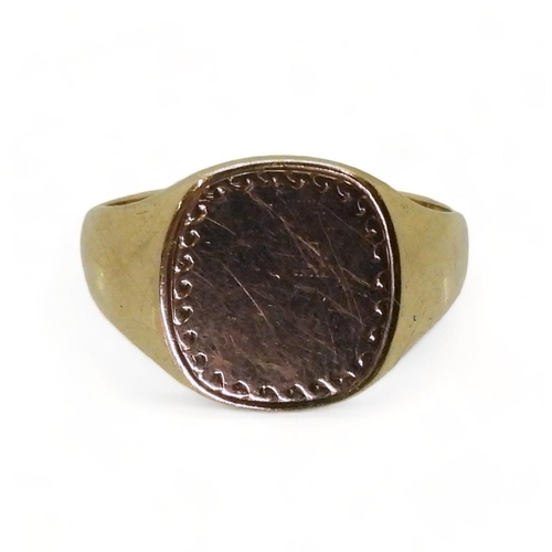 723 - A 9ct gold signet ring, size V, weight 5gms