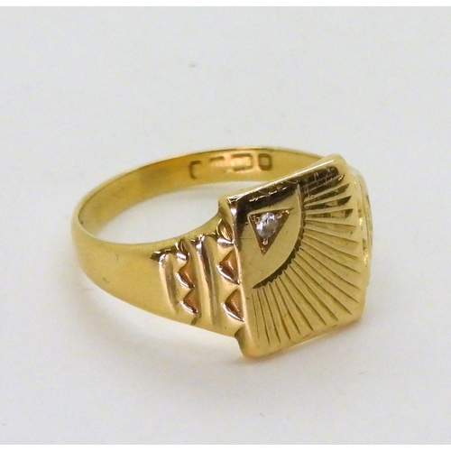 726 - An 18ct gold gents signet ring, with sunrise design, set with a diamond, finger size U, weight 5.7gm... 