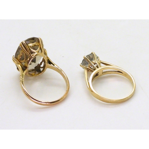 729 - A 9ct gold smoky quartz ring, stamped Zeeta, finger size M, and a clear gem set solitaire, size L1/2... 