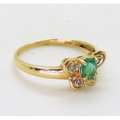 730 - A 14k gold emerald and diamond accent butterfly shaped ring, P, weight 1.9gms