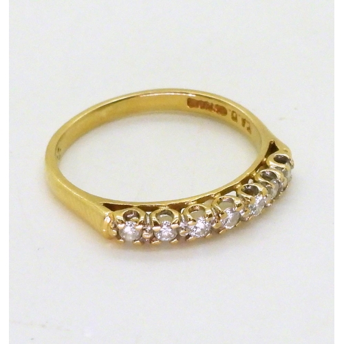 731 - An 18ct gold diamond half eternity ring, set with estimated approx 0.20cts of brilliant cuts, size O... 