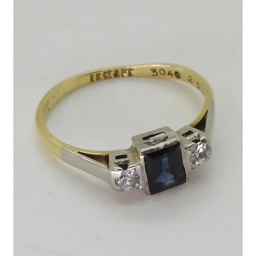 746 - An 18ct and platinum sapphire and diamond ring set with a square cut sapphire of approx 5mm x 4mm x ... 