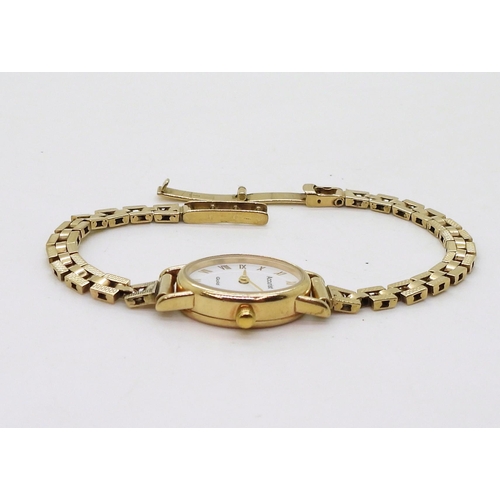757A - A 9ct gold ladies Accurist watch and strap, weight with mechanism 14.7gms