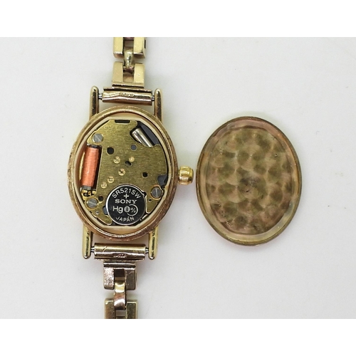 757A - A 9ct gold ladies Accurist watch and strap, weight with mechanism 14.7gms