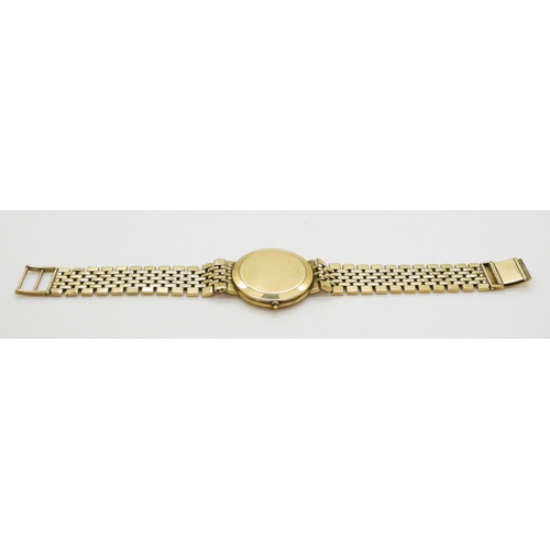 758 - A 9ct gold gents Rotary Elite watch and strap, weight all together 56.6gms