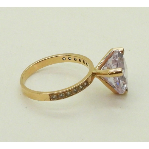 767 - A Russian 14k gold ring and earring suite, set with purple cubic zirconia trilliant cuts, and clear ... 