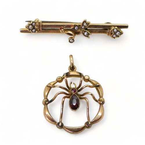 771 - A 9ct gold garnet set spider pendant, diameter 2.2cm and a 9ct gold brooch, weight together 4gms