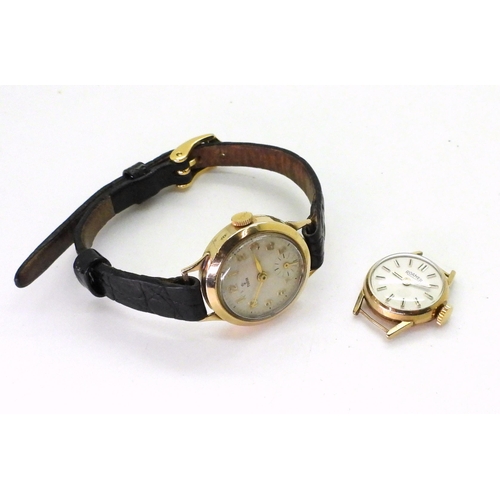 775 - A 9ct cased ladies Tudor watch with black leather strap, number stamped to the mechanism 2325, toget... 