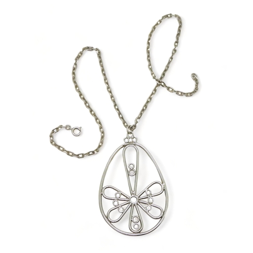 783 - A 1970's Retro flower pendant and chain by Glen Kelso Frame, with Edinburgh hallmarks for 1978 with ... 