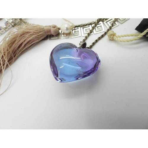 795 - A signed Baccarat purple heart pendant, a silver moonstone and iolite bracelet, Mexican silver Sun b... 