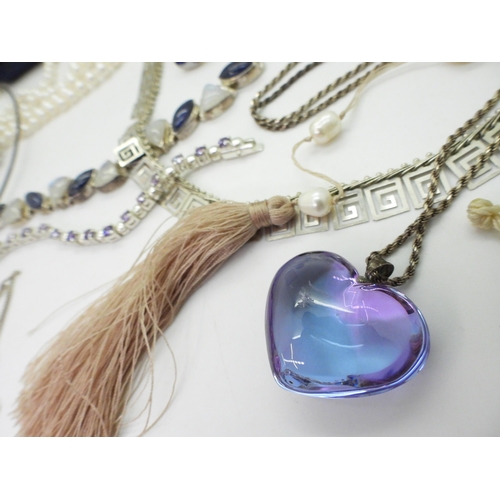 795 - A signed Baccarat purple heart pendant, a silver moonstone and iolite bracelet, Mexican silver Sun b... 