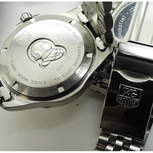 A Ladies Tag Heuer professional 200 meters with green chapter ring