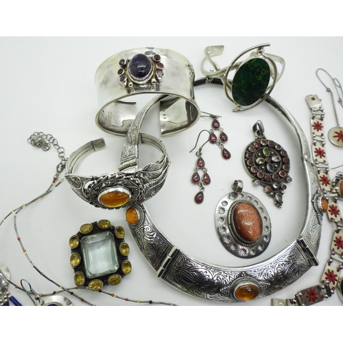 805 - A collection of gem set silver jewellery to include an amber torc style necklace and similar bracele... 