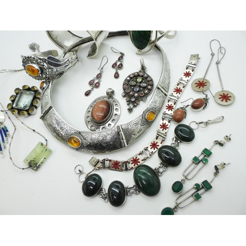 805 - A collection of gem set silver jewellery to include an amber torc style necklace and similar bracele... 