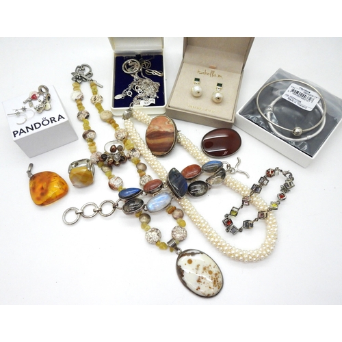 809 - Two silver Pandora bracelets, with two diamante rondel charms with hearts  and a teddy, a silver mou... 