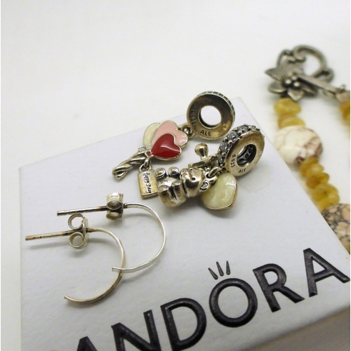 809 - Two silver Pandora bracelets, with two diamante rondel charms with hearts  and a teddy, a silver mou... 