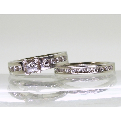 778B - A platinum wedding set made by Blair & Sheridan of Glasgow, comprising of a engagement ring set ... 