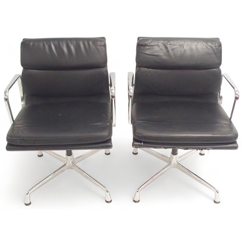 2117 - A PAIR OF VITRA EAMES EA 208 SOFT PAD CHAIRS with black soft leather upholstery and chrome open arms... 