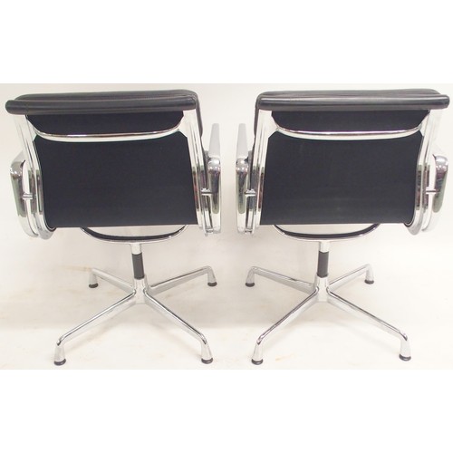 2117 - A PAIR OF VITRA EAMES EA 208 SOFT PAD CHAIRS with black soft leather upholstery and chrome open arms... 