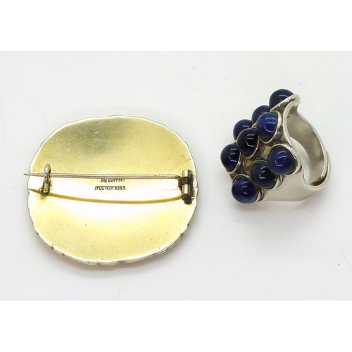 2802 - TWO RETRO NORWEGIAN JEWELSa silver ring by Uni David Andersen, set with nine lapis lazuli cabochons,... 