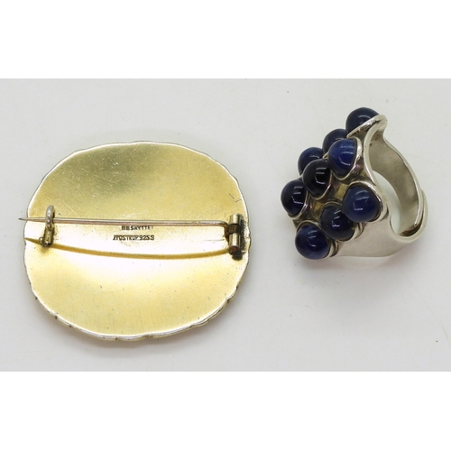 2802 - TWO RETRO NORWEGIAN JEWELSa silver ring by Uni David Andersen, set with nine lapis lazuli cabochons,... 