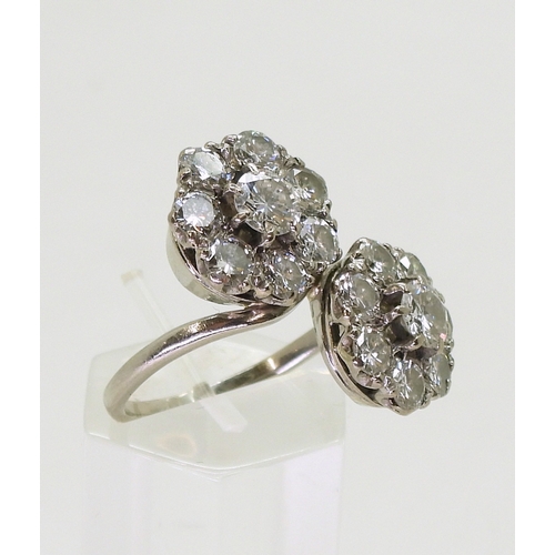 2804 - A DIAMOND DOUBLE FLOWER RINGmounted in white metal and set with estimated approx 2.50cts in total., ... 