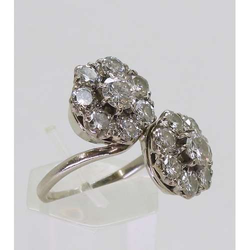 2804 - A DIAMOND DOUBLE FLOWER RINGmounted in white metal and set with estimated approx 2.50cts in total., ... 